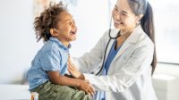 A doctor and child with stethoscope AI-generated content may be incorrect.